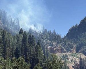 Snow shed fire continues to burn on Red Mountain Pass