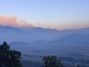 Firefighters building, reinforcing lines, as high winds return today